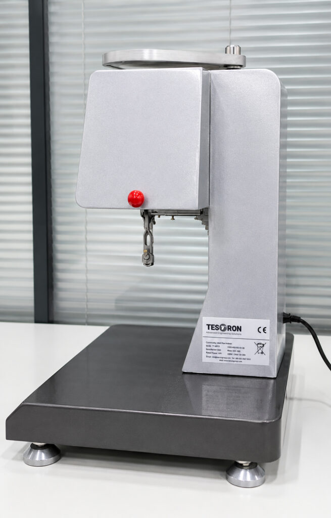 Precision heating chamber and extrusion die of an advanced melt flow index machine.
