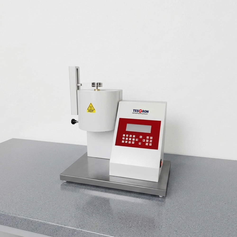 Laboratory setup featuring an automated benchtop melt flow index tester for plastic quality control.